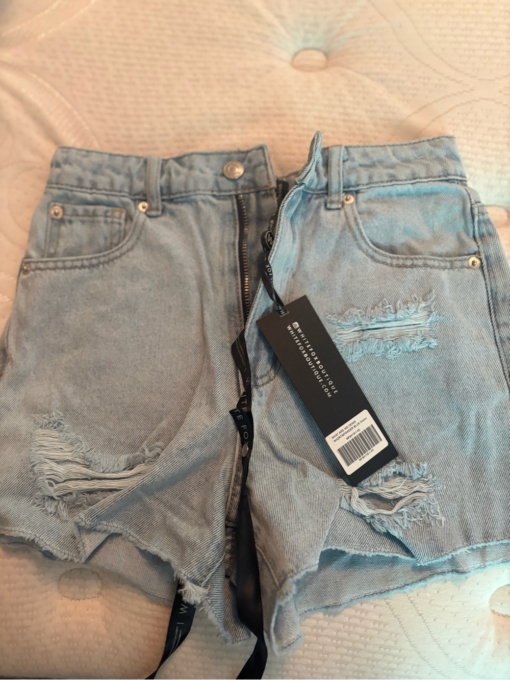 White Fox Boutique Light Blue Ripped Denim Shorts